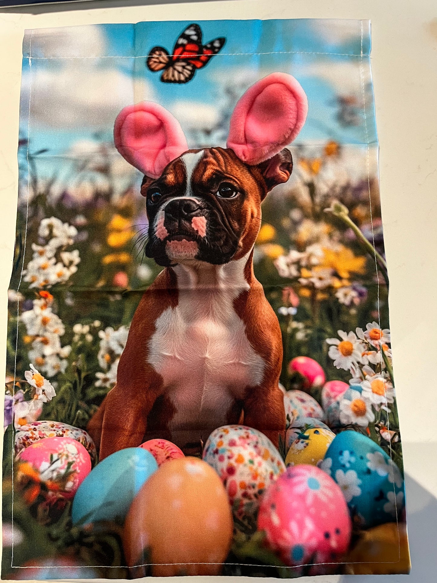 Boxer puppy with bunny ear flag